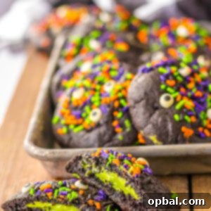 Midnight Velvet Stuffed Cookies 9 Stuffed Black Velvet Cookies with a vibrant green cheesecake filling and spooky Halloween sprinkles.