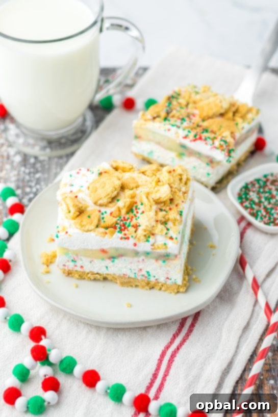 Yuletide Cookie Bliss 12 The festive Christmas Cookie Lush recipe, serving as the ultimate holiday dessert, is no-bake for quick preparation during entertaining. It features delectable layers of vanilla cream cookies, vibrant sprinkles, a rich cheesecake layer, a smooth pudding layer, a generous whipped topping, and is adorned with crushed cookies and additional sprinkles for a perfect Christmas cookie aesthetic.