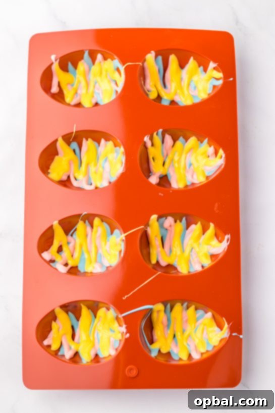 Sweet Easter Mallow Treats 4 Pouring the ingredients into the egg molds to make the Easter Marshmallow Eggs recipe