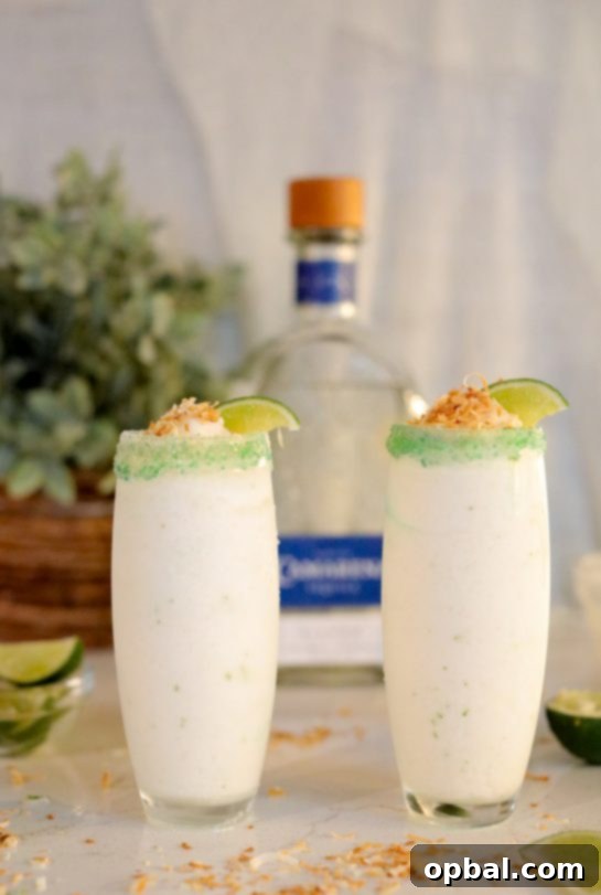 Zesty Coconut Lime Margarita Oasis 2 Creamy Coconut Lime Frozen Margaritas with a toasted coconut rim, perfect for summer parties.