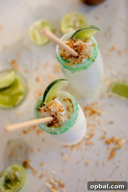 Zesty Coconut Lime Margarita Oasis 8 Coconut Lime Frozen Margaritas served at a vibrant summer party setting, ready for enjoyment.