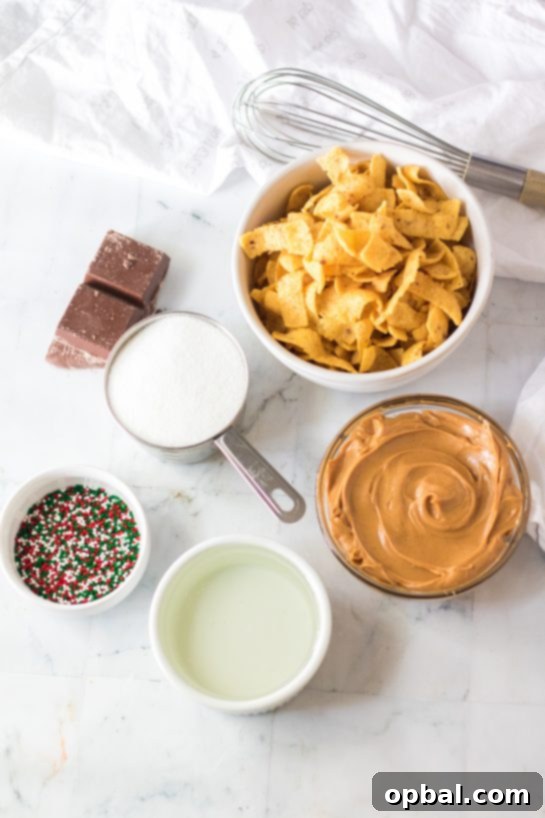 Frito Candy ingredients laid out for preparation, including sugar, light corn syrup, creamy peanut butter, corn chips, chocolate chips, and sprinkles, ready for a festive Christmas treat.