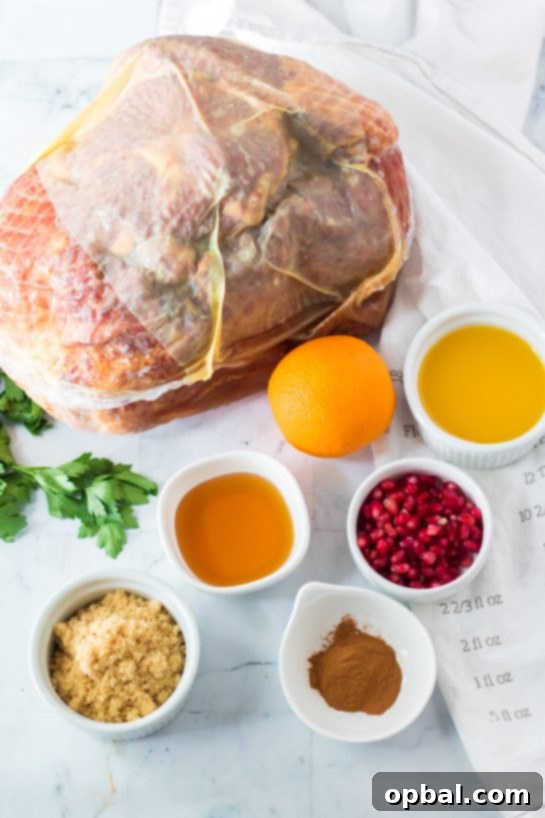Christmas Glazed Ham 3 Ingredients for the festive orange, honey, and brown sugar glazed Christmas ham recipe, laid out beautifully for preparation.
