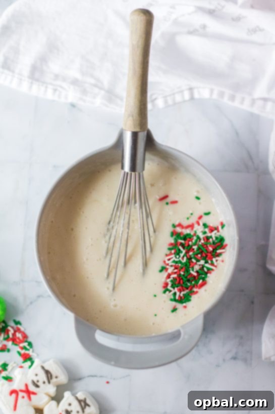 Holiday Spirit Poke Cake 4 Photo of mixing the ingredients needed to make this Christmas Poke Cake recipe