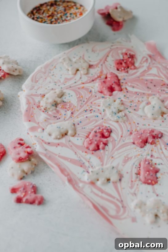 No-Bake Circus Cookie Bark ready to be cut into pieces, showing its vibrant layers.
