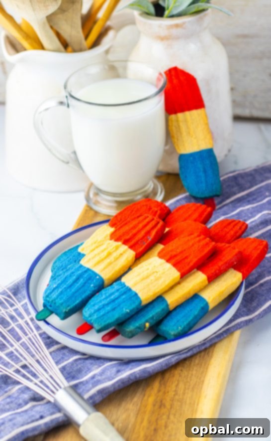 Firecracker Pop Cookies 2 Delicious and vibrant red, white, and blue Bomb Pop Cookies ready for 4th of July celebrations