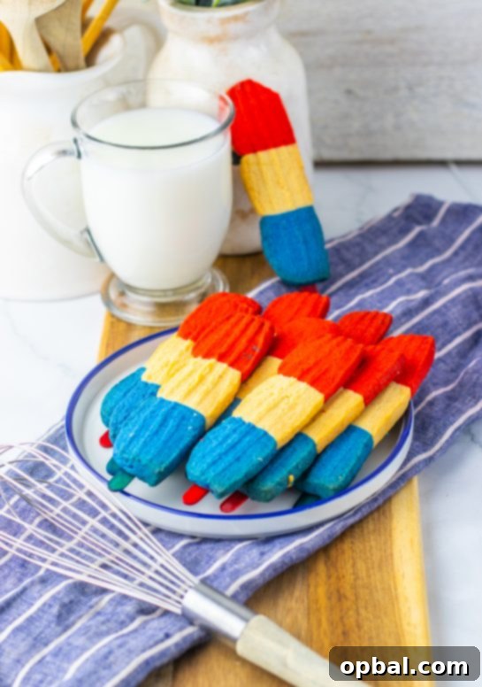 Firecracker Pop Cookies 9 Red, white, and blue Bomb Pop Cookies arranged on a serving tray for outdoor parties and picnics