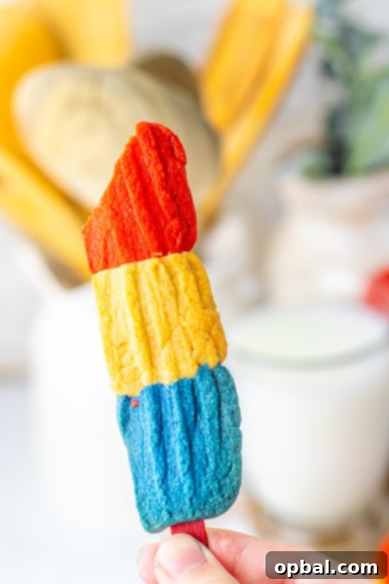Firecracker Pop Cookies 10 Close-up photo of a finished Bomb Pop Cookie, showcasing its layered texture and vibrant colors