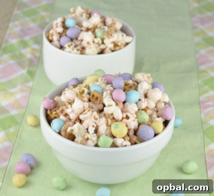 Delicious Salted Caramel Easter Popcorn adorned with colorful peanut M&Ms, perfect for spring gatherings and Easter baskets.