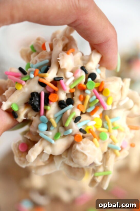Halloween needs fun, festive, and easy White Chocolate Halloween Crock Pot Candy made with crunchy chow mein noodles, creamy white chocolate bark, and colorful Halloween sprinkles. These no-bake Halloween treats are the perfect last-minute party snack or spooky holiday dessert made right in the crock pot that all ages will love.