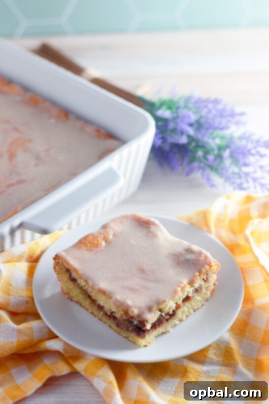Glazed Honey Swirl Cake 11 Easy Honey Bun Cake recipe made with yellow cake mix, sour cream, and chopped pecans is a Southern-inspired dessert that tastes just like a warm bakery honey bun! Perfectly moist, swirled with brown sugar and cinnamon, and topped with a sweet glaze, this easy doctored cake mix recipe comes together in minutes — no fancy baking skills required.