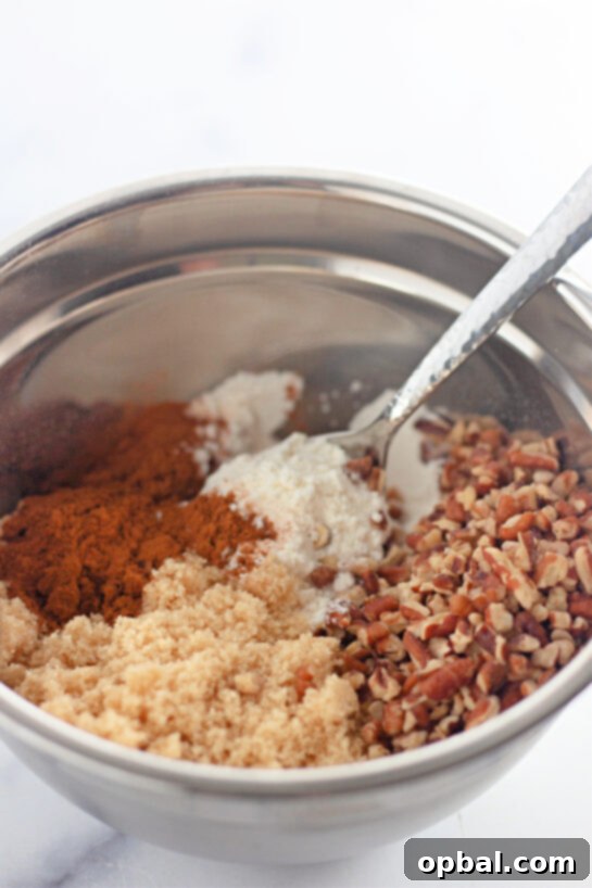 Glazed Honey Swirl Cake 5 Mixing the dry ingredients needed to make the Honey Bun Cake recipe for the holidays