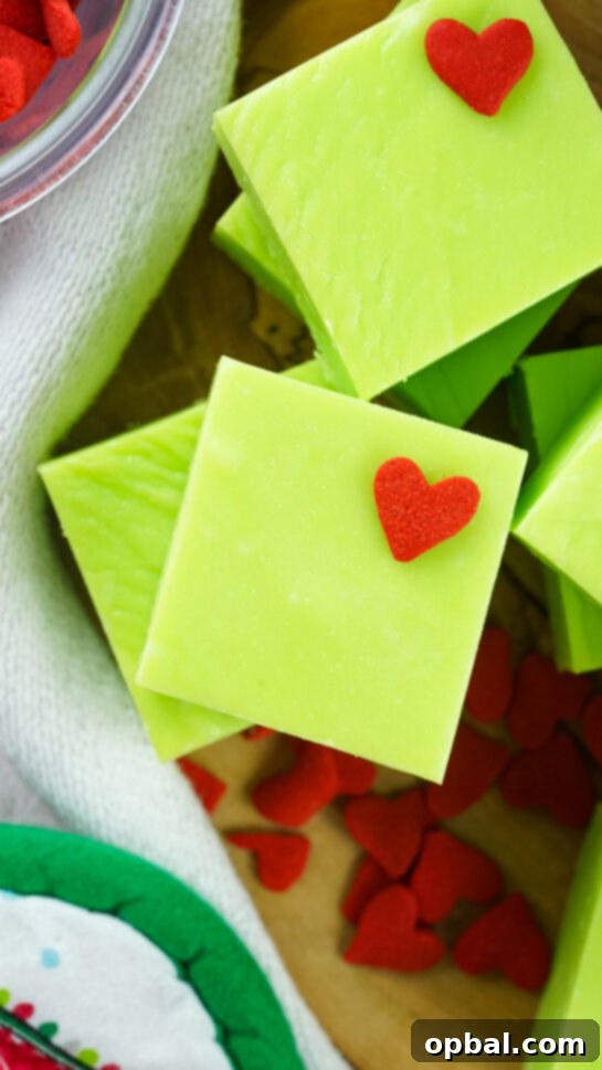 Close-up of Grinch Fudge with heart sprinkles.