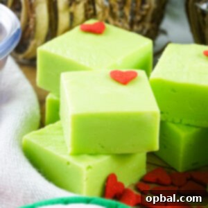 Grinch Fudge Recipe: Creamy, no-bake Christmas fudge with white chocolate, sweetened condensed milk, and green food coloring. Perfect for holiday parties!