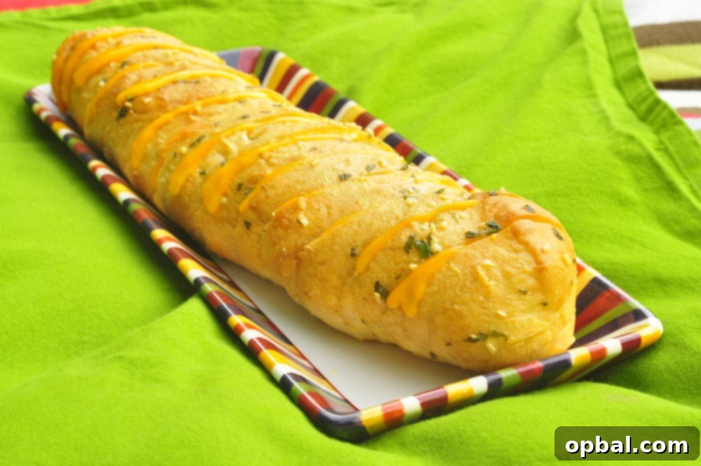 Garlic Cheesy Hasselback Bread, baked to perfection.