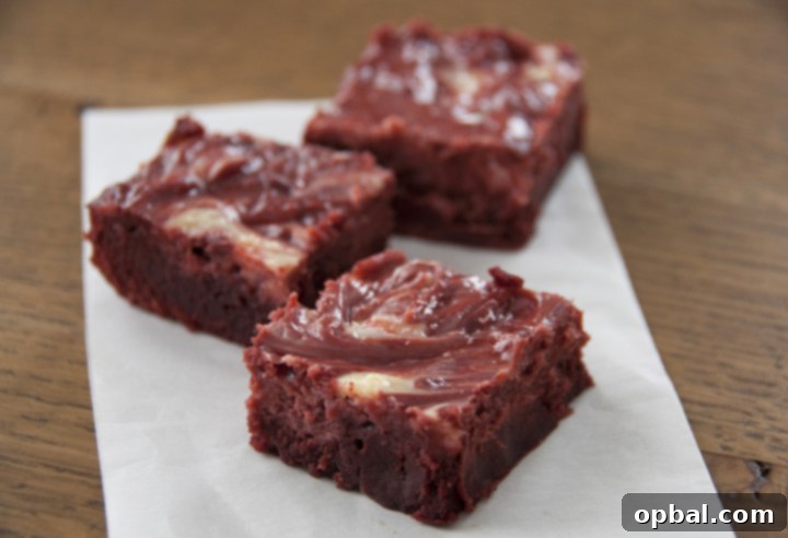 Swirled Red Velvet Cheesecake Brownies 2 These Red Velvet Cheesecake Brownies are rich, decadent, swirled with cheesecake, and so perfect for Christmas or Valentine’s Day! Brownie and cheesecake batter combined together make for a festive and impressive dessert.