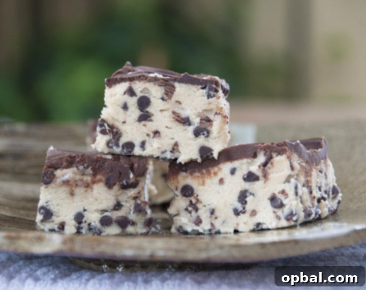 A stack of delicious No-Bake Chocolate Chip Cookie Dough Bars on a plate, ready to be enjoyed as a simple, no-fuss dessert.