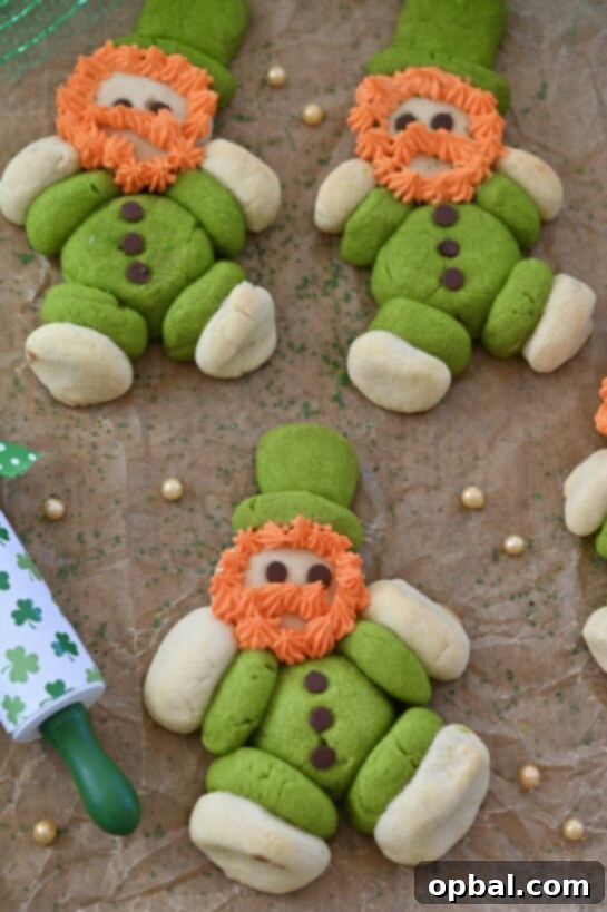Leprechaun's Lucky Cookie Delights 5 Overhead shot of several chubby, cute Lucky Leprechaun Cookies on a baking sheet, showcasing their festive St. Patrick's Day appeal and inviting texture.