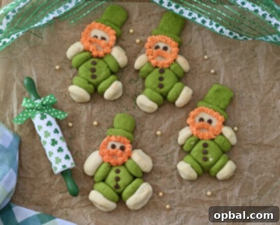 Leprechaun's Lucky Cookie Delights 8 A charming image displaying the assembly process of the Sugar Cookie Lucky Leprechaun Cookies, with individual dough pieces forming the character before baking for St. Patrick's Day.