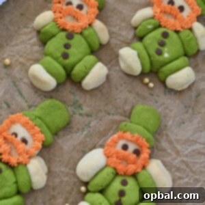 Leprechaun's Lucky Cookie Delights 10 Lucky Leprechaun Cookies made with green and white sugar cookie dough, mini chocolate chip buttons, and fluffy orange frosting beards. These cute, chubby St. Patrick's Day leprechaun cookies are a fun, festive, and easy holiday dessert recipe perfect for parties, kids, and St. Patrick’s Day baking.
